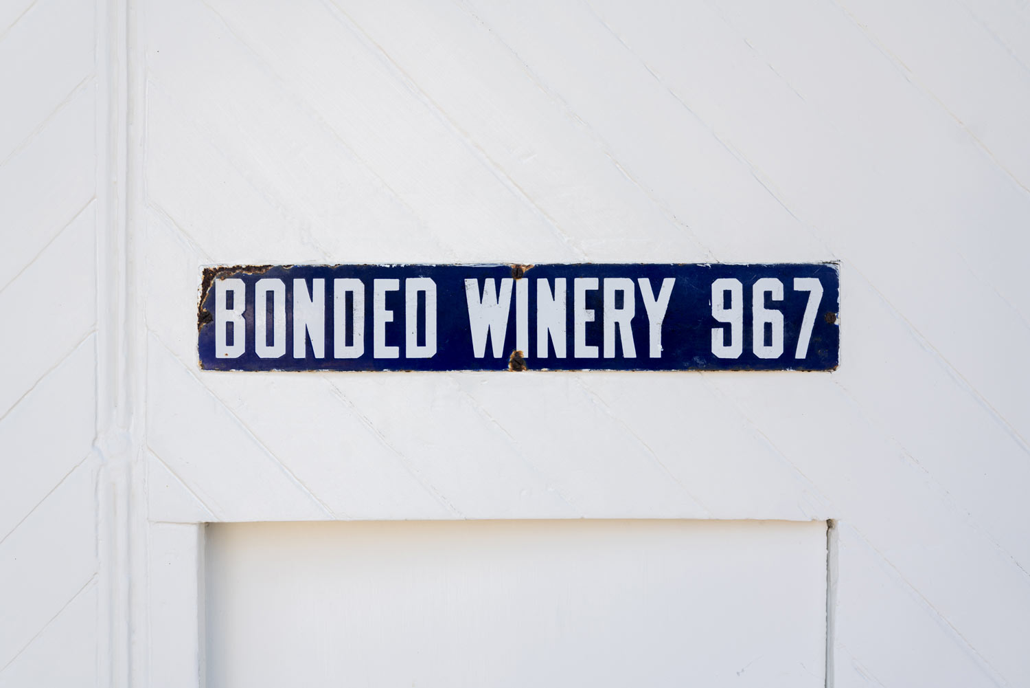 Close-up of the Bonded Winery 967 sign above the old cellar door